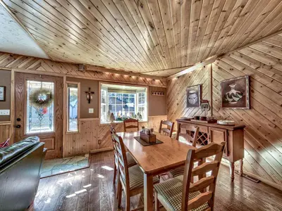 a dining room with a wooden ceiling at 2556H Lazy Bear's Den in South Lake Tahoe