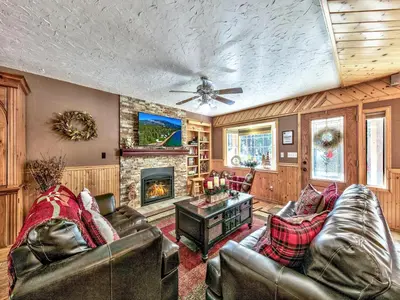 a living room with leather furniture and a fireplace at 2556H Lazy Bear's Den in South Lake Tahoe