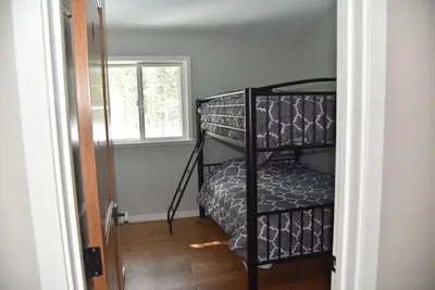 a room with a bunk bed in a room at 2375S Sierra house Retreat in South Lake Tahoe
