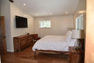 a bedroom with a bed and a flat screen tv at 2375S Sierra house Retreat in South Lake Tahoe