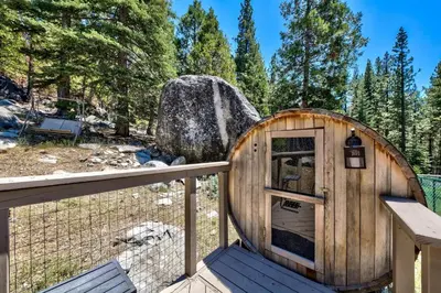 a wooden dog house on a wooden deck at 3001R Reindeer A Frame Cabin in South Lake Tahoe