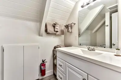 a bathroom with a sink and a mirror at 2782B Tahoe River Chalet in South Lake Tahoe