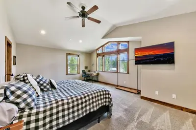a bedroom with a bed and a ceiling fan at Mountain View Retreat 1008C in South Lake Tahoe
