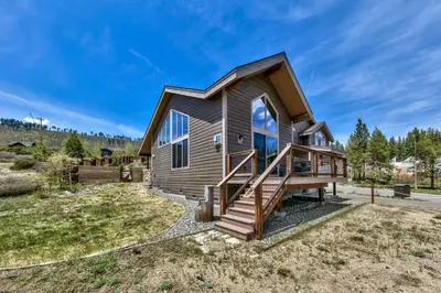 a home with a gambrel roof and a deck at Mountain View Retreat 1008C in South Lake Tahoe