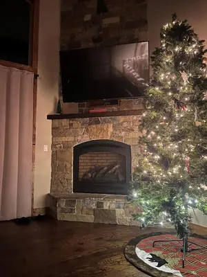 a christmas tree in a living room with a fireplace at Mountain View Retreat 1008C in South Lake Tahoe