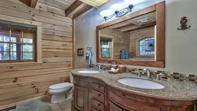 a bathroom with two sinks and a mirror at Tahoe Moose Lodge 1170AC in South Lake Tahoe