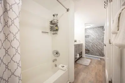 a bathroom with a shower and a bath tub at Stunning Deluxe King Studio #124 at Donner Lake Village in Truckee