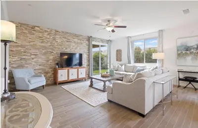 a living room with a couch and a tv at Casita Tulare in Tulare