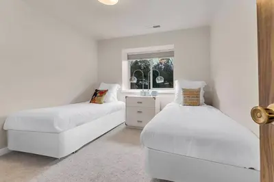 a white bedroom with two beds and a window at Lake Tahoe Getaway Close to Beach & Ski Slopes in Tahoe City