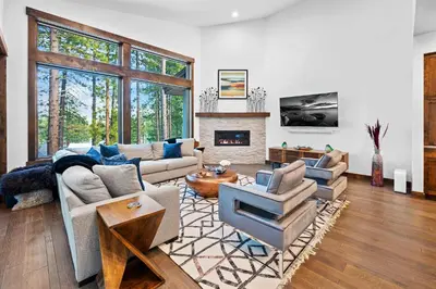 a living room filled with furniture and a fireplace at Luxurious Truckee Rental Hot Tub and Valley Views in Truckee