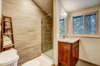 a bathroom with a toilet and a sink and a shower at Miztec Mountain - Ping pong & basketball hoop game in South Lake Tahoe