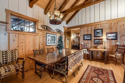 a dining room with a wooden table and chairs at Lakefront Luxury in Tahoe City