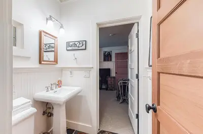 a white bathroom with a sink and a mirror at Lakefront Luxury in Tahoe City