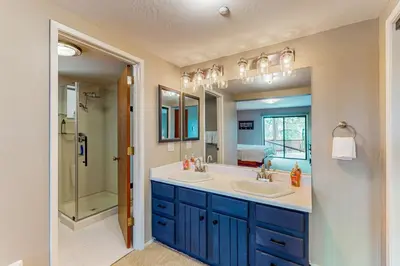 a bathroom with two sinks and a large mirror at Cliffside Retreat in Zephyr Cove