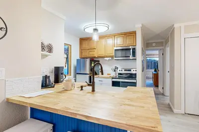 a kitchen with a wooden counter top in a room at Lakeside Life in Tahoe Vista