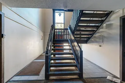 a spiral staircase in a building with a window at Lakeside Life in Tahoe Vista