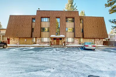 a building with a car parked in a parking lot at Lakeside Life in Tahoe Vista