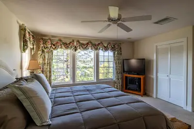 a bedroom with a large bed and a window at Falls Lake View Winter Special Ends512 in Bass Lake