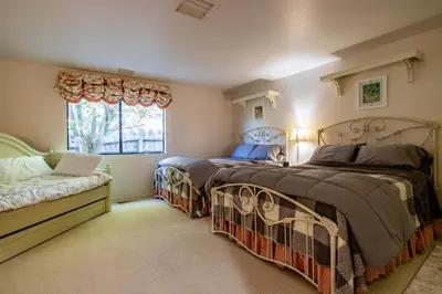 a bedroom with two beds and a window at Falls Lake View Winter Special Ends512 in Bass Lake