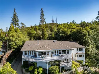 an aerial view of a house with a large deck at Falls Lake View Winter Special Ends512 in Bass Lake