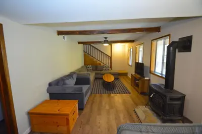 a living room with a couch and a stove at SunRidge at Willow Cove Free Night Special in Bass Lake