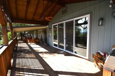 a porch of a house with sliding glass doors at Ledge House-Lake Area Free Night Special in Bass Lake