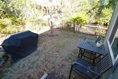 a yard with a picnic table and a fence at Ledge House-Lake Area Free Night Special in Bass Lake