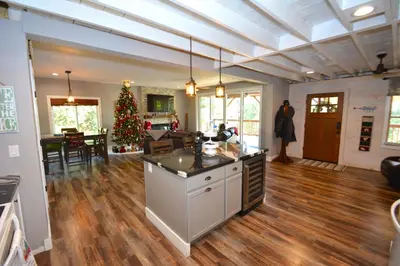 a kitchen and living room with a christmas tree at Ledge House-Lake Area Free Night Special in Bass Lake