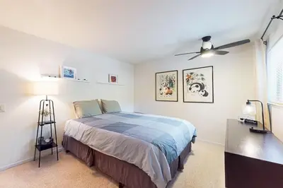 a bedroom with a bed and a ceiling fan at Wildwood Wonder in South Lake Tahoe