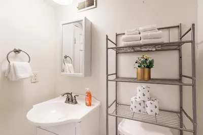 a bathroom with a sink and a toilet and towels at Wildwood Wonder in South Lake Tahoe