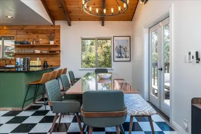 a dining room with a table and chairs at Yosemite Lookout Lodge w/ hot tub, firepits, game room, and more in Oakhurst