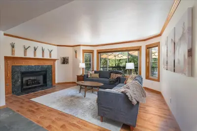 a living room with a couch and a fireplace at Greystone Manor- HUGE home with sleeping for 21 in Oakhurst