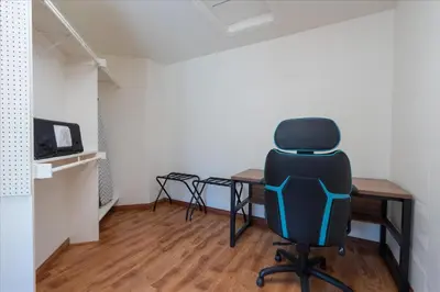 a chair sitting at a desk in a room at Greystone Manor- HUGE home with sleeping for 21 in Oakhurst