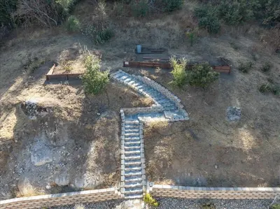 an overhead view of a set of stairs on the ground at Hilltop Paradise with stunning views/hot tub/firepit/dog friendly in Oakhurst