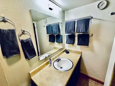 a bathroom with a sink and a mirror at Treetop Condo in Yosemite-Sleeps 6-Balcony in Yosemite West