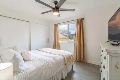 a bedroom with a bed and a ceiling fan at Cozy Family Haven in Sparks - Pet Friendly - Fenced Yard in Sparks