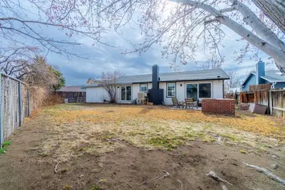 an empty yard in front of a house at Cozy Family Haven in Sparks - Pet Friendly - Fenced Yard in Sparks
