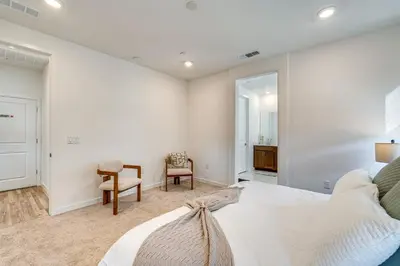 a bedroom with a bed and a desk and a chair at 15 Mi to Dtwn Sacramento Newly Built Home! in Sacramento