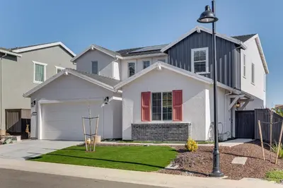 a white house with red windows and a driveway at 7 Mi to Folsom Lake Sacramento Area Apartment in Folsom
