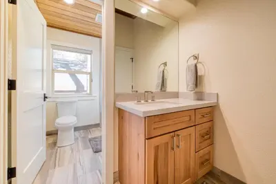 a bathroom with a sink and a toilet at Venture in Tahoe Donner by Tahoe Getaways - 4 BR W Hot Tub, Pool Table, Great for Kids! in Truckee