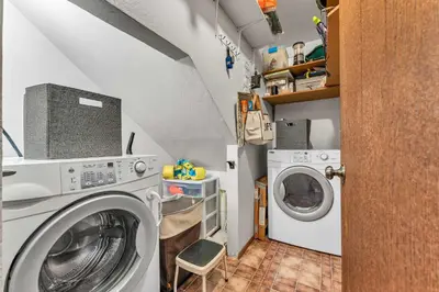 a small laundry room with a washer and dryer at Kings Beach Cabin Private Hot Tub, Near Lake & Ski in Kings Beach
