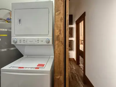 a washer and dryer sitting on top of a refrigerator at Cozy Carnelian Bay Vacation Rental with Lake Views in Carnelian Bay
