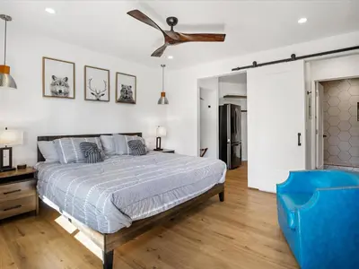 a bedroom with a bed and a ceiling fan at Experience the Beauty of Tahoe from Your Zephyr Cove Retreat! #2 in Zephyr Cove