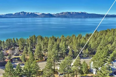 arial view of a lake with trees and mountains at Zephyr Cove first level 1 Bed: close to everything bike, ski, swim! in Zephyr Cove