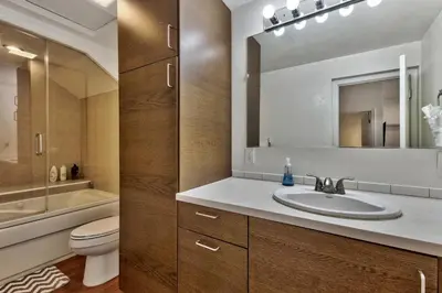 a bathroom with a sink and a toilet and a mirror at Zephyr Cove first level 1 Bed: close to everything bike, ski, swim! in Zephyr Cove