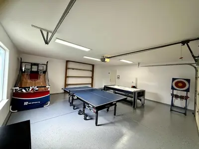 a room with two ping pong tables in it at Yosemite Vista Highlands in Oakhurst