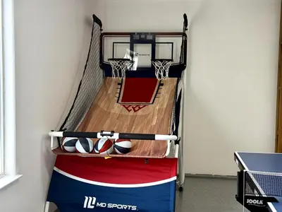 a indoor basketball court with a net and balls at Yosemite Vista Highlands in Oakhurst