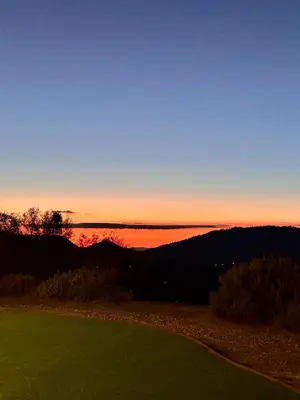 a view of the sunset from a golf course at Yosemite Vista Highlands in Oakhurst