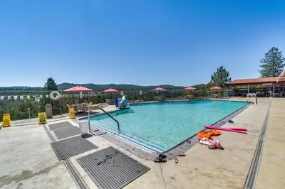 a swimming pool at a resort at Access to Pine Mountain Lake Family Cabin with Deck in Groveland