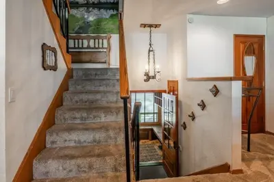a staircase in a home with a stair case at Canyon Slopeside Retreat in Mammoth Lakes
